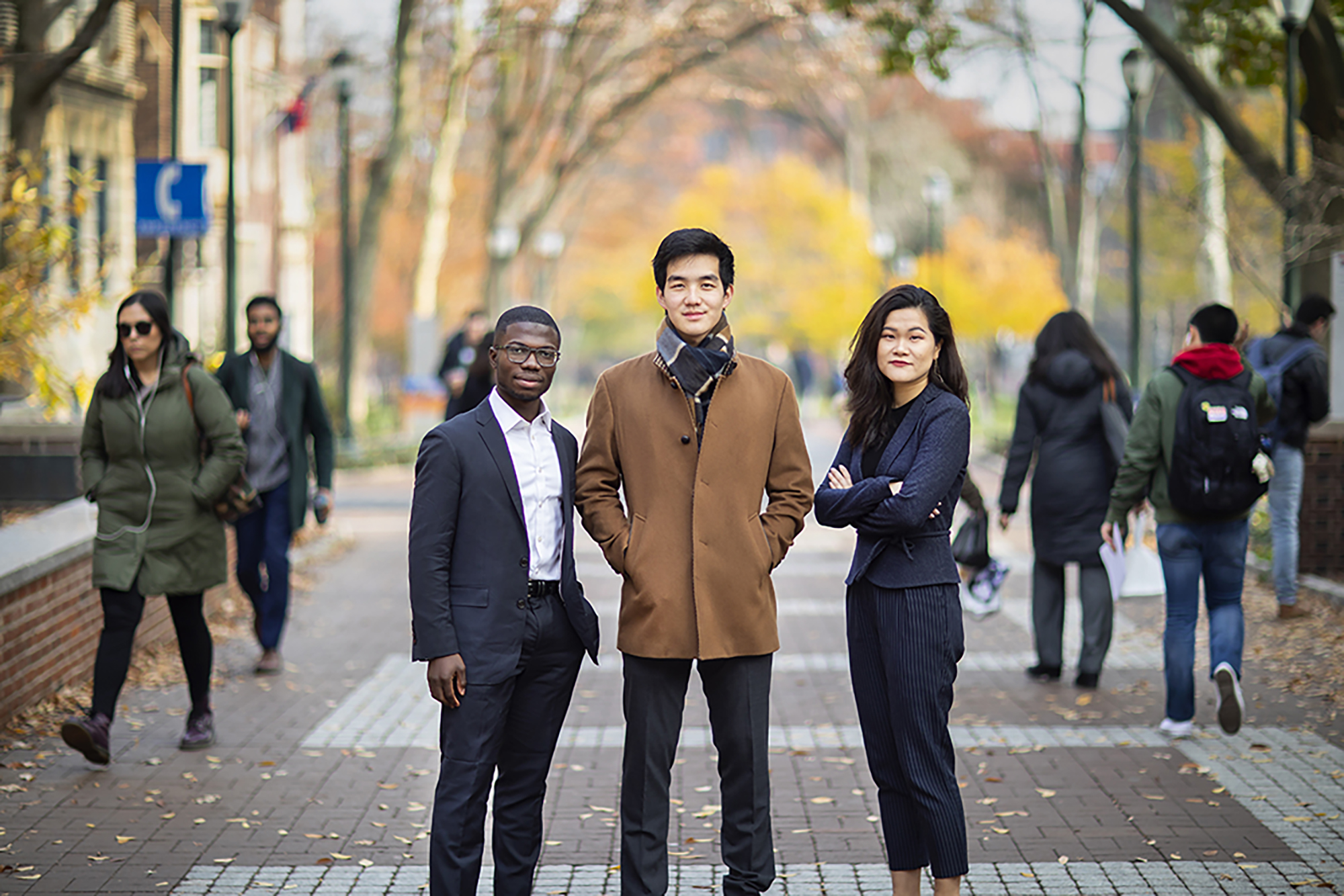 Adejare Chen and Zeng standing on Locust Walk