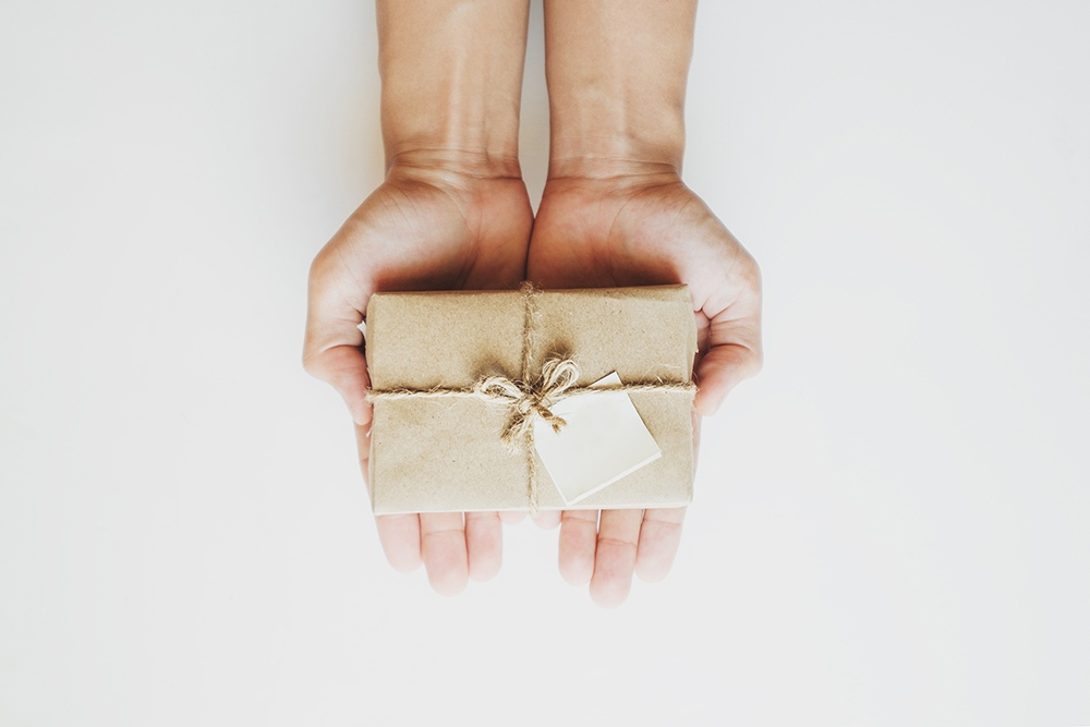 hands holding small gift box