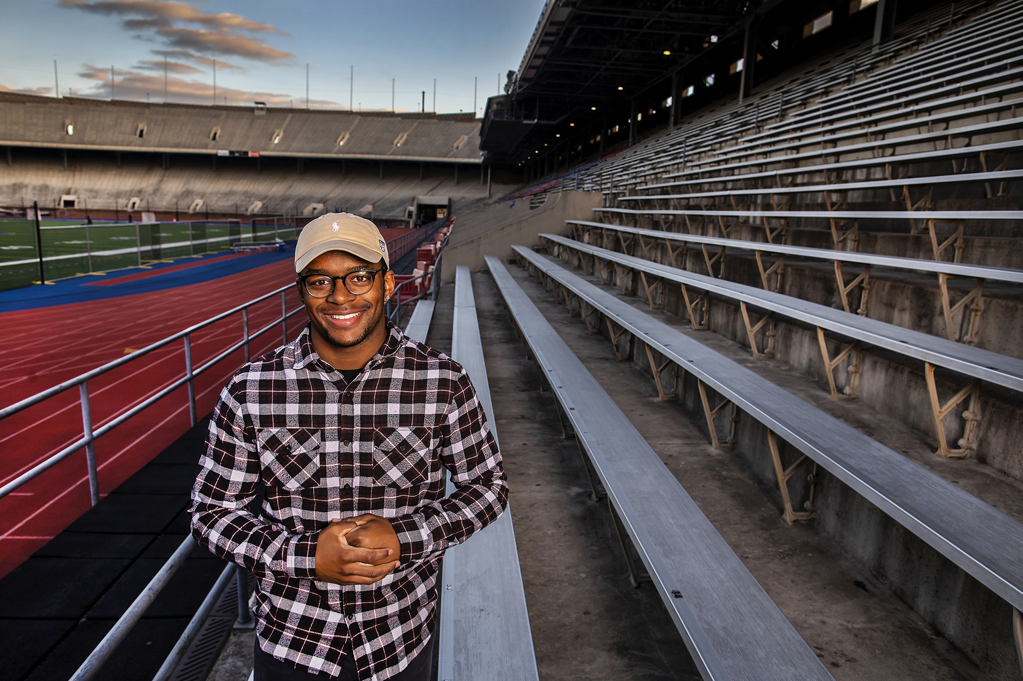 Nick Miller of the Penn football teams poses in the Franklin Field bleachers