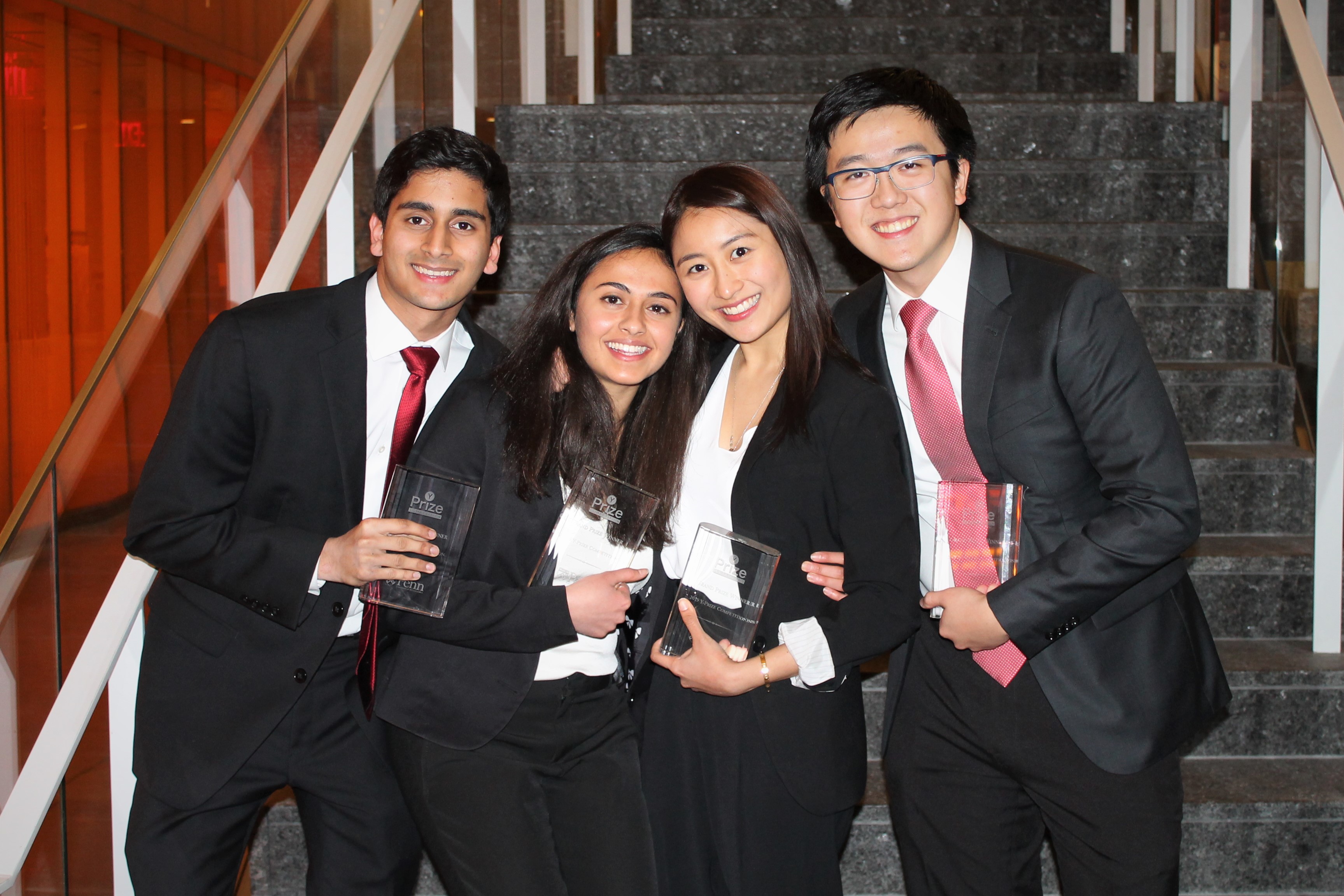 The four Y-Prize winners with their trophies.