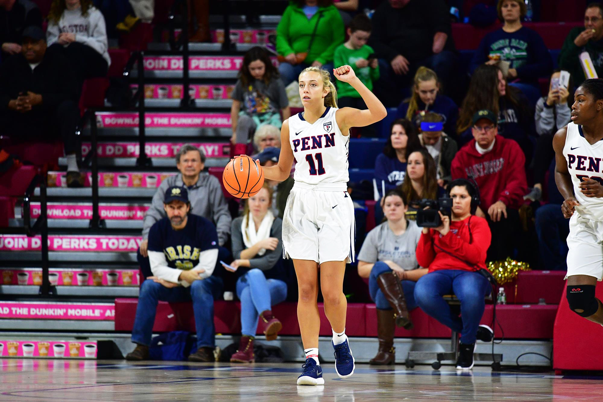 Junior guard Kendall Grasela dribbles up the court during a game at the Palestra.
