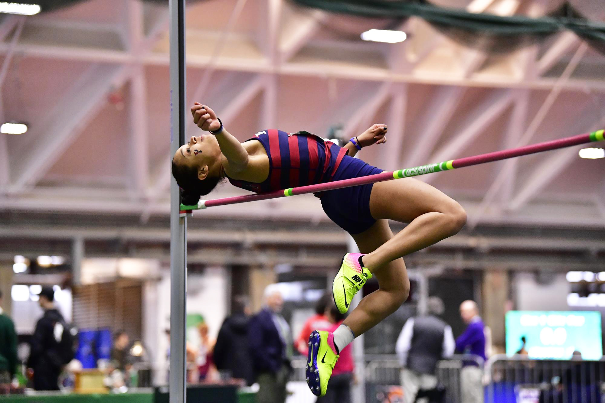 Elena Brown-Soler of the track and field performs the high jump at an indoor event.