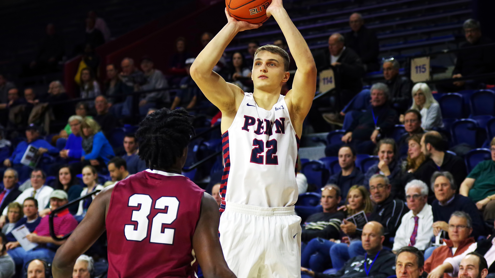 Kuba Mijakowski of the men's basketball team shoots a jump shot.