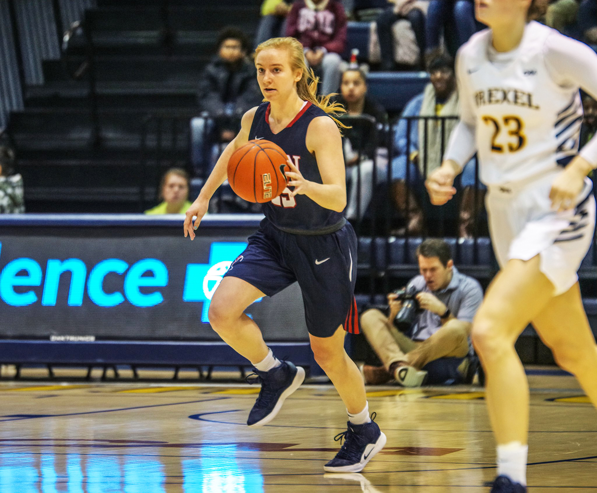 Ashley Russell pushes the ball up the court in an away game at Drexel.