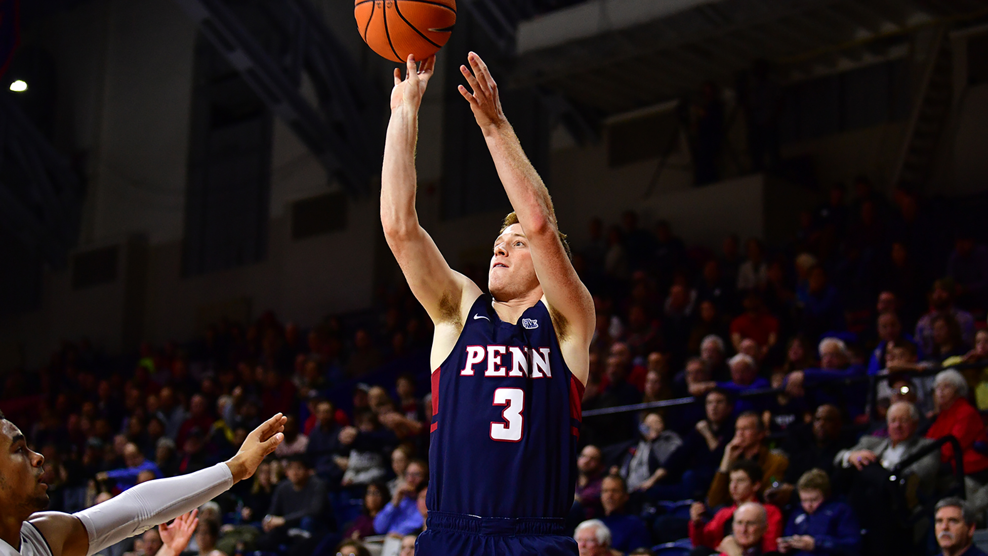 Jake Silpe of the basketball team shoots a jump shot