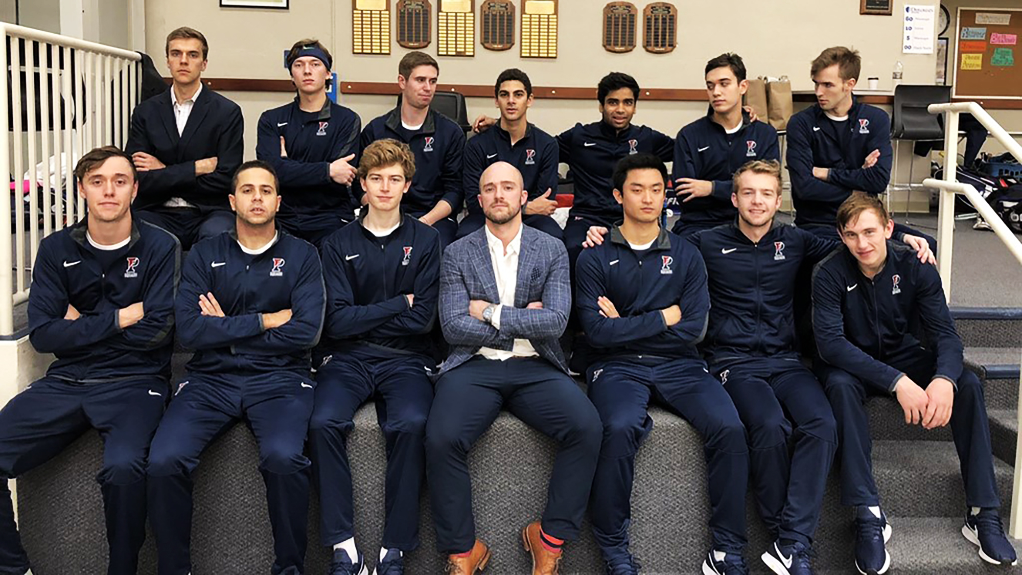 Penn men's squash players and the head coach
