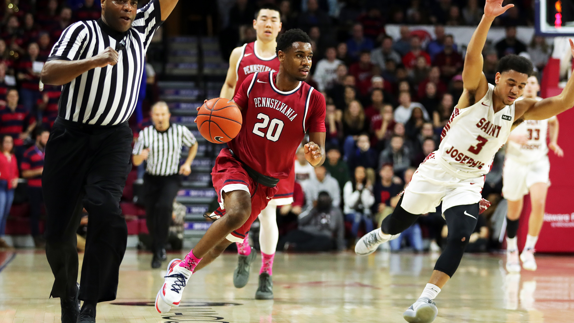 Freshman guard Bryce Washington dribbles up the court against Saint Joseph's at the Palestra.