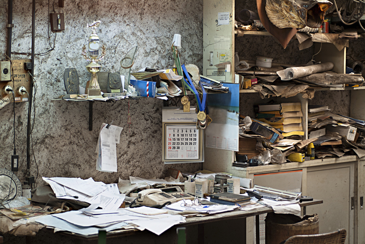 cluttered, filthy abandoned office
