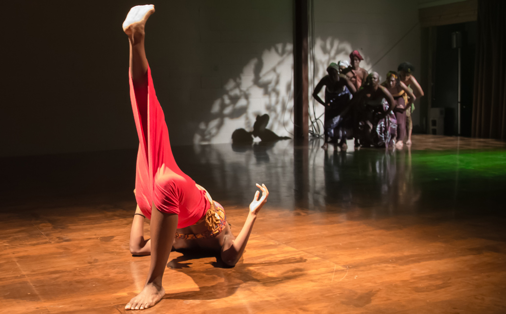 Woman dancing on floor of stage