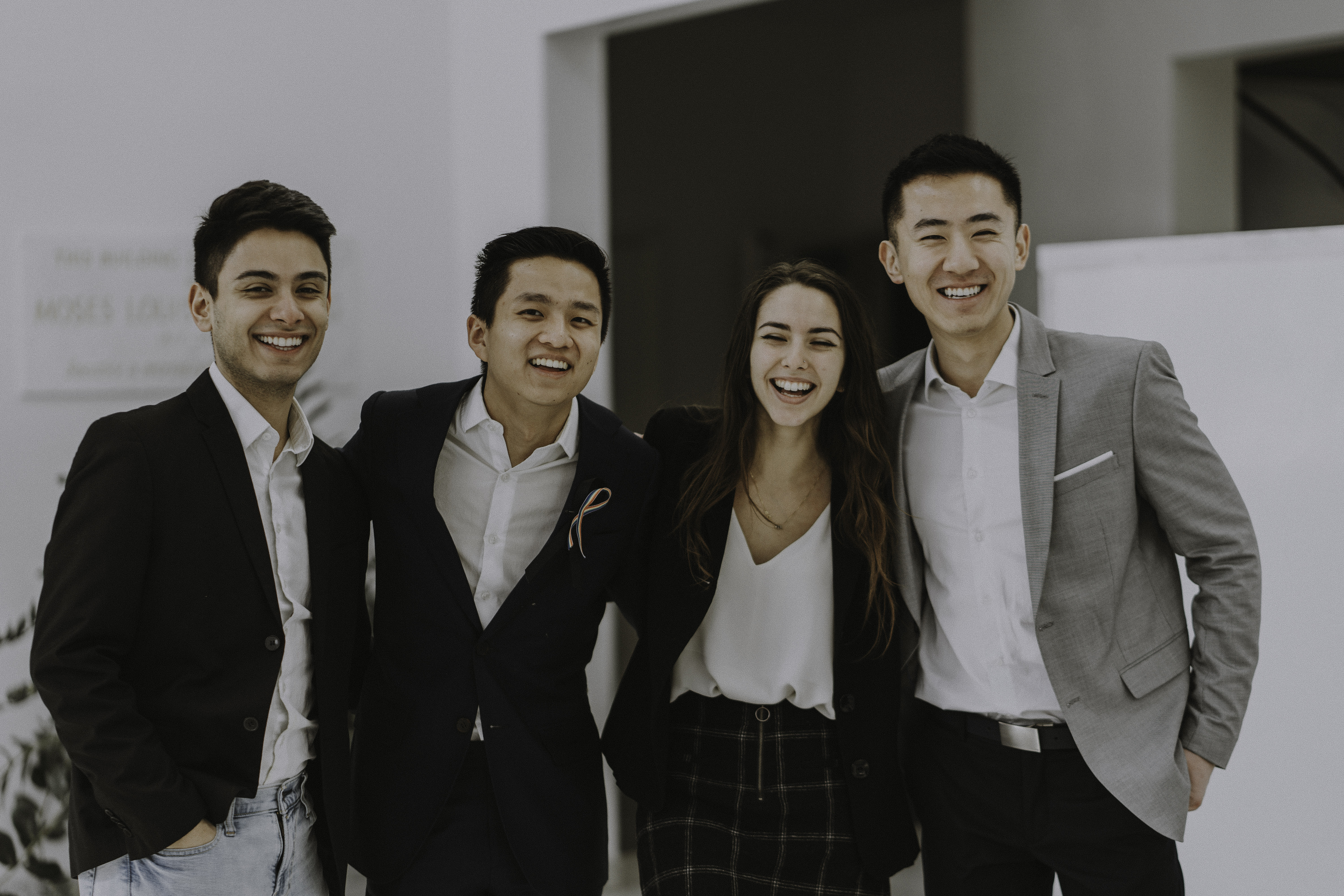 Wharton Alliance members smile and pose in business attire