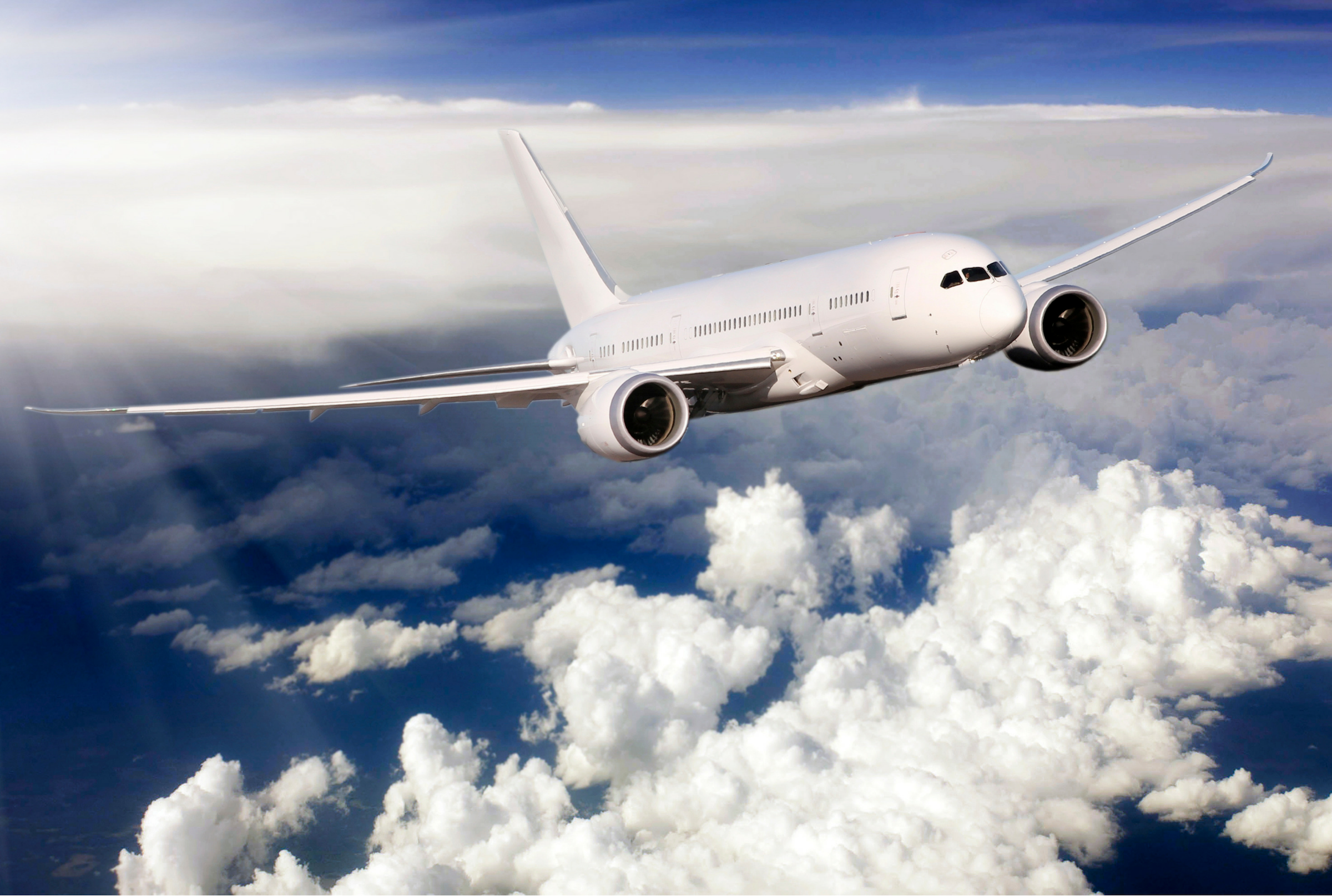 Airplane flying above clouds