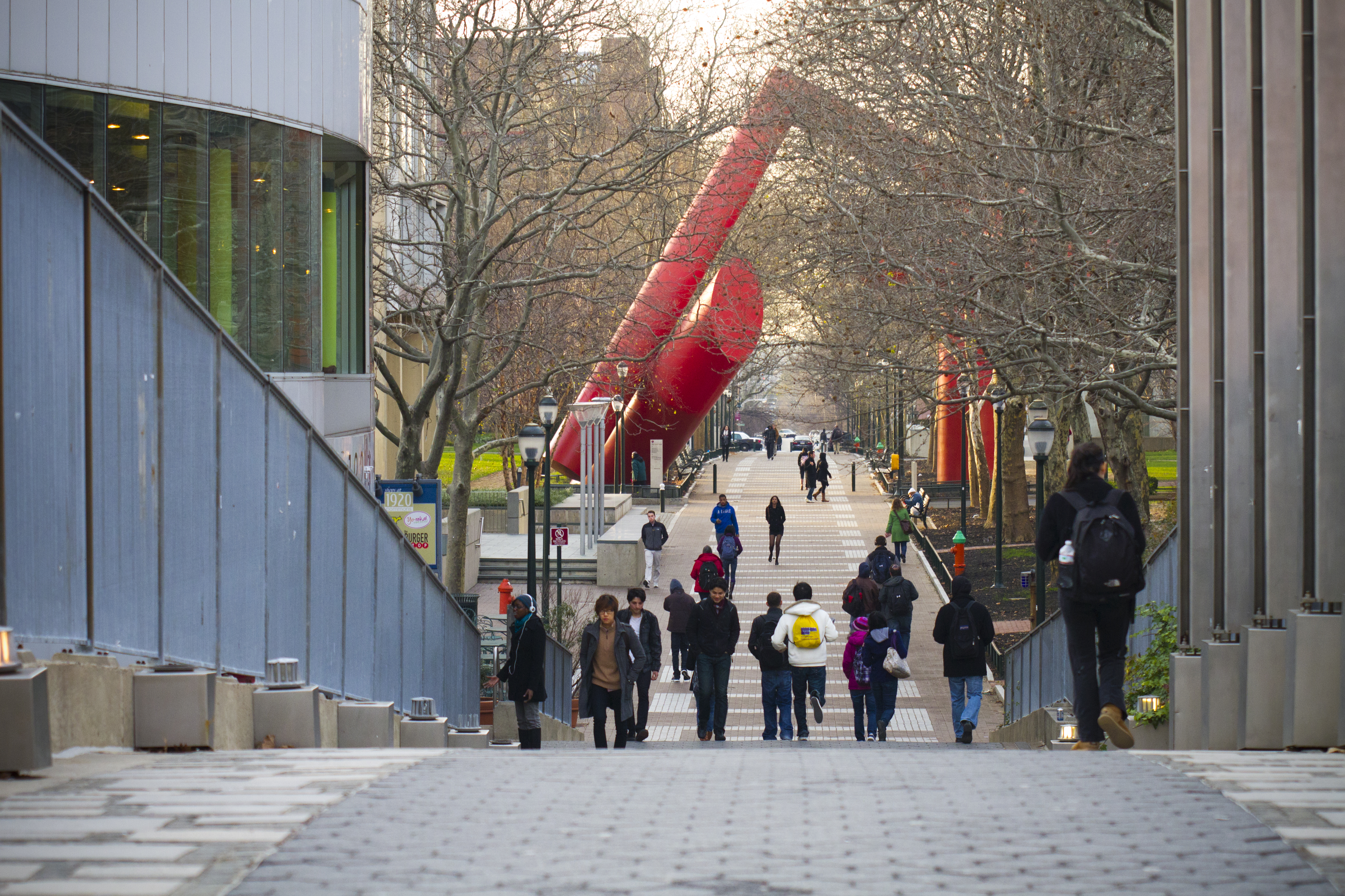 students walk on locust walk