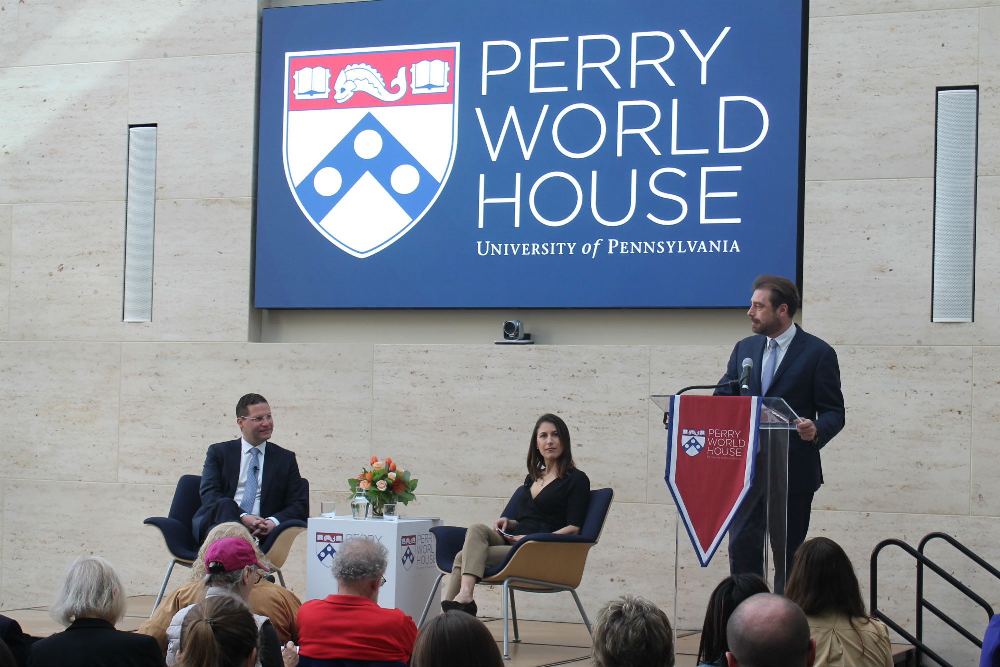Speakers on stage at Perry World House