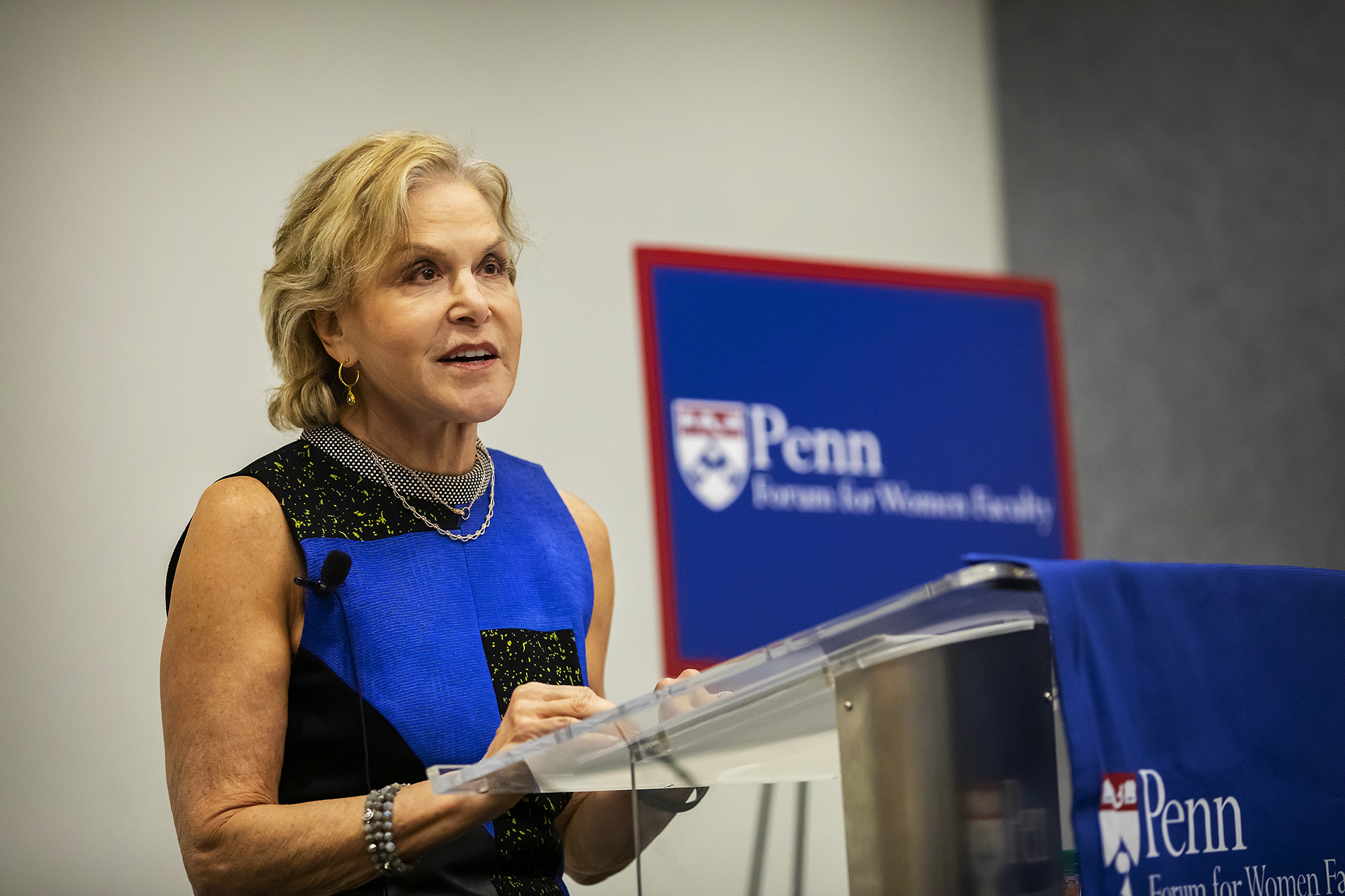 Judith Rodin dressed in blue at podium