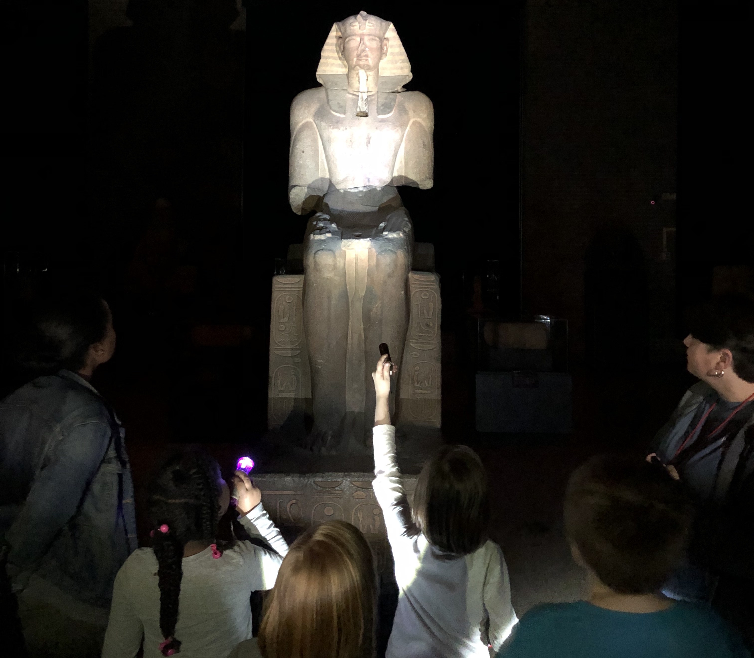 Kids with statue and flashlights