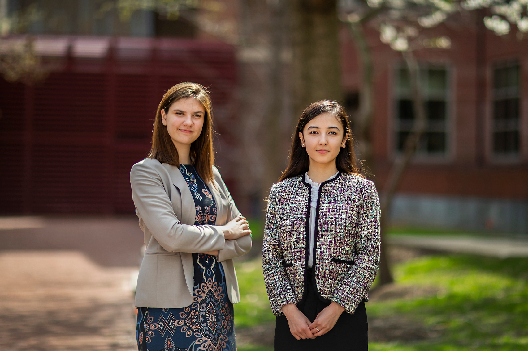 Katherine Sizov and Malika Shukurova posing outside