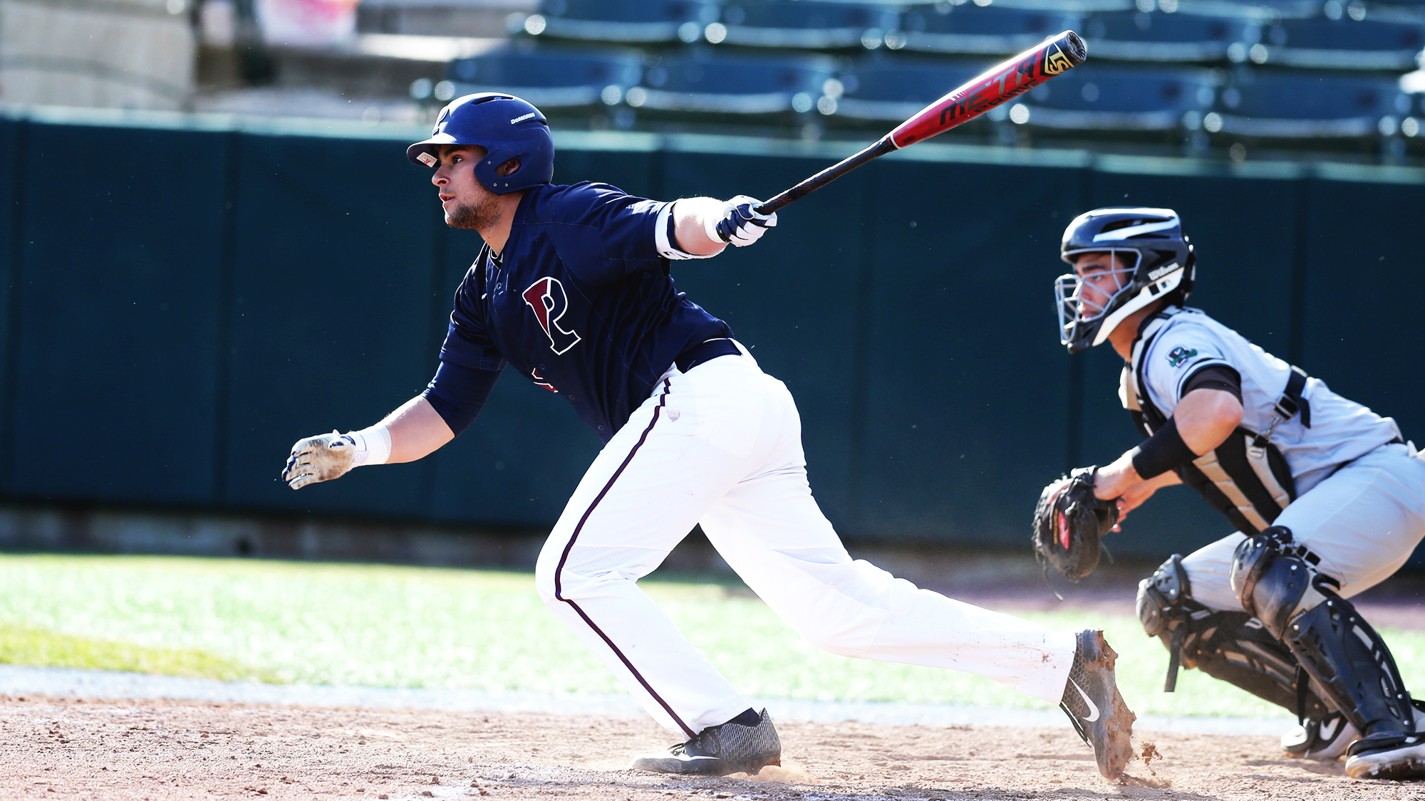 Freshman Andrew Hernandez heads to first base after making contact with the ball during a game.