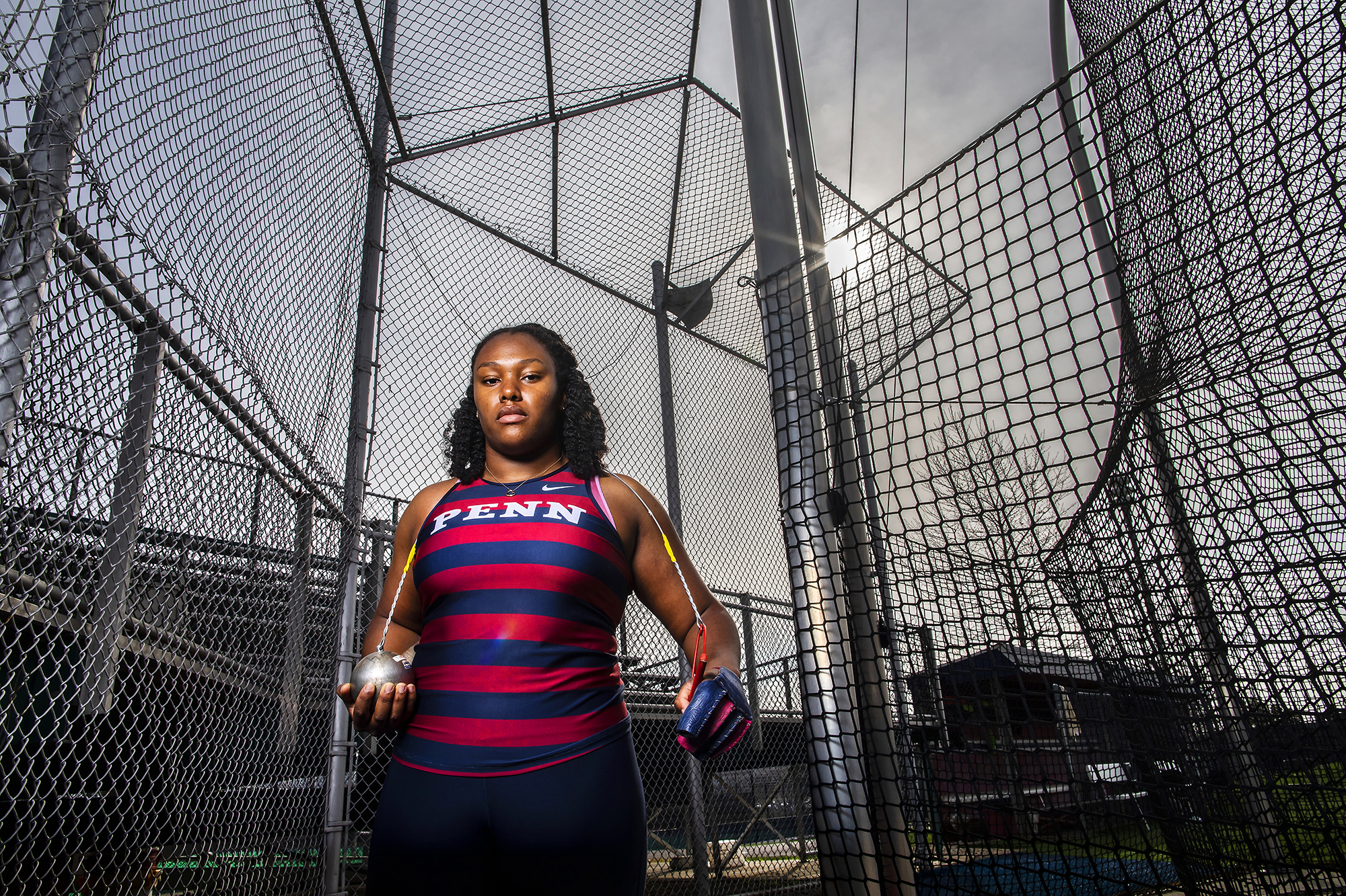 Rachel Lee Wilson poses with the hammer at the throwing field.