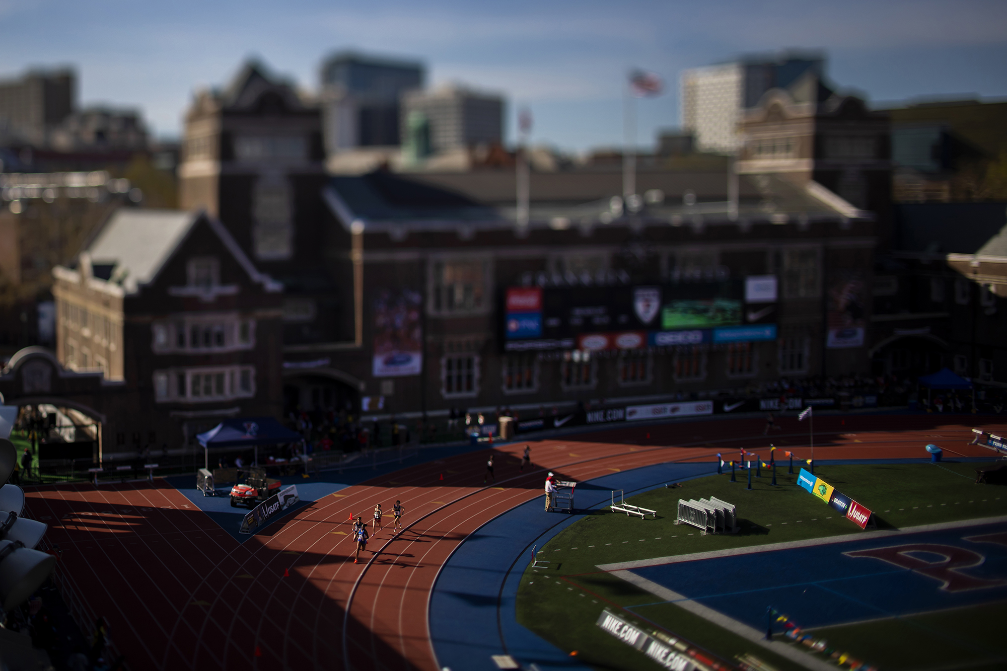 Runners race around the track at the 2018 Penn Relays.