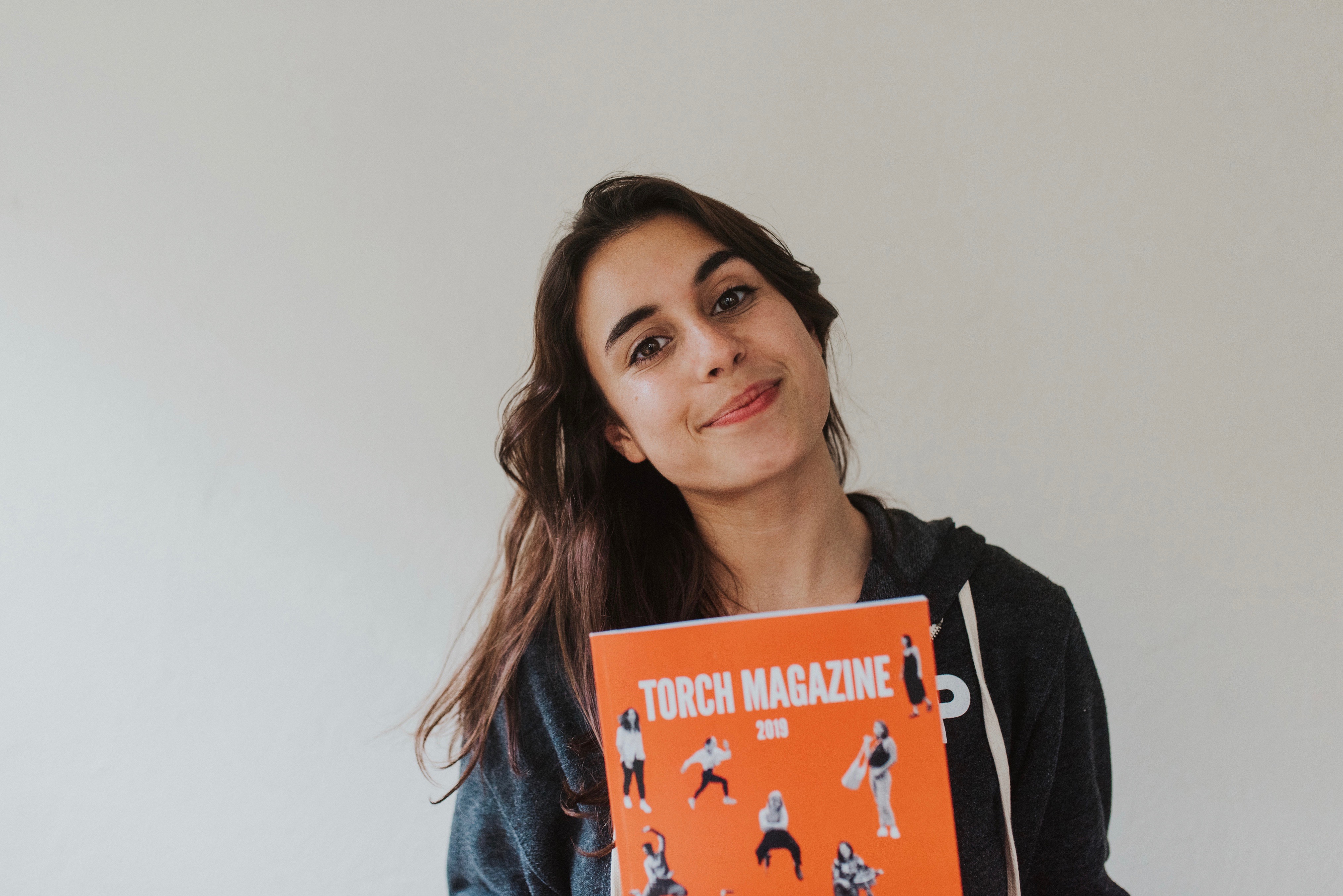 Student holding magazine