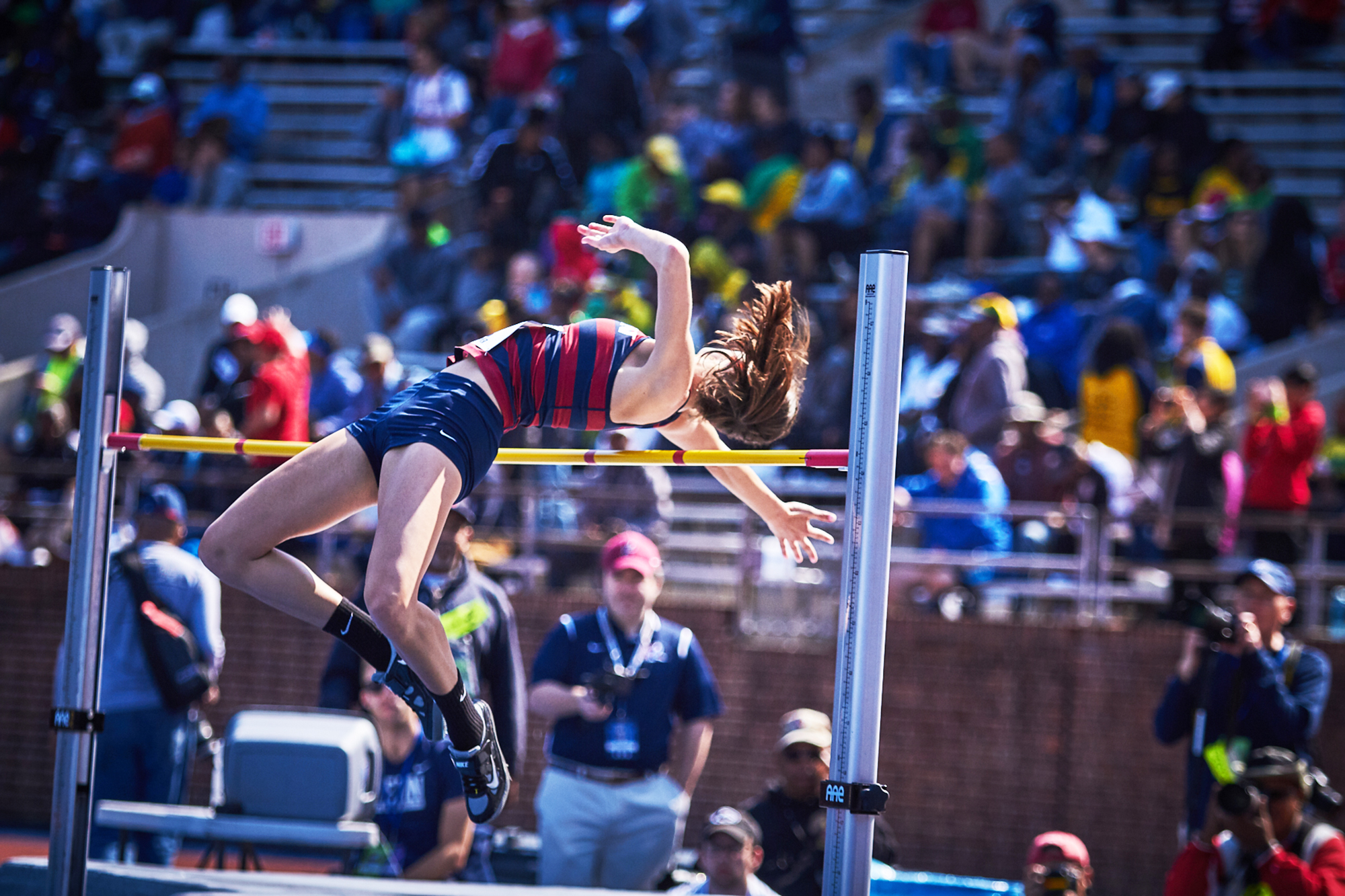 Anna Peyton Malizia jumps over the high jump bar.