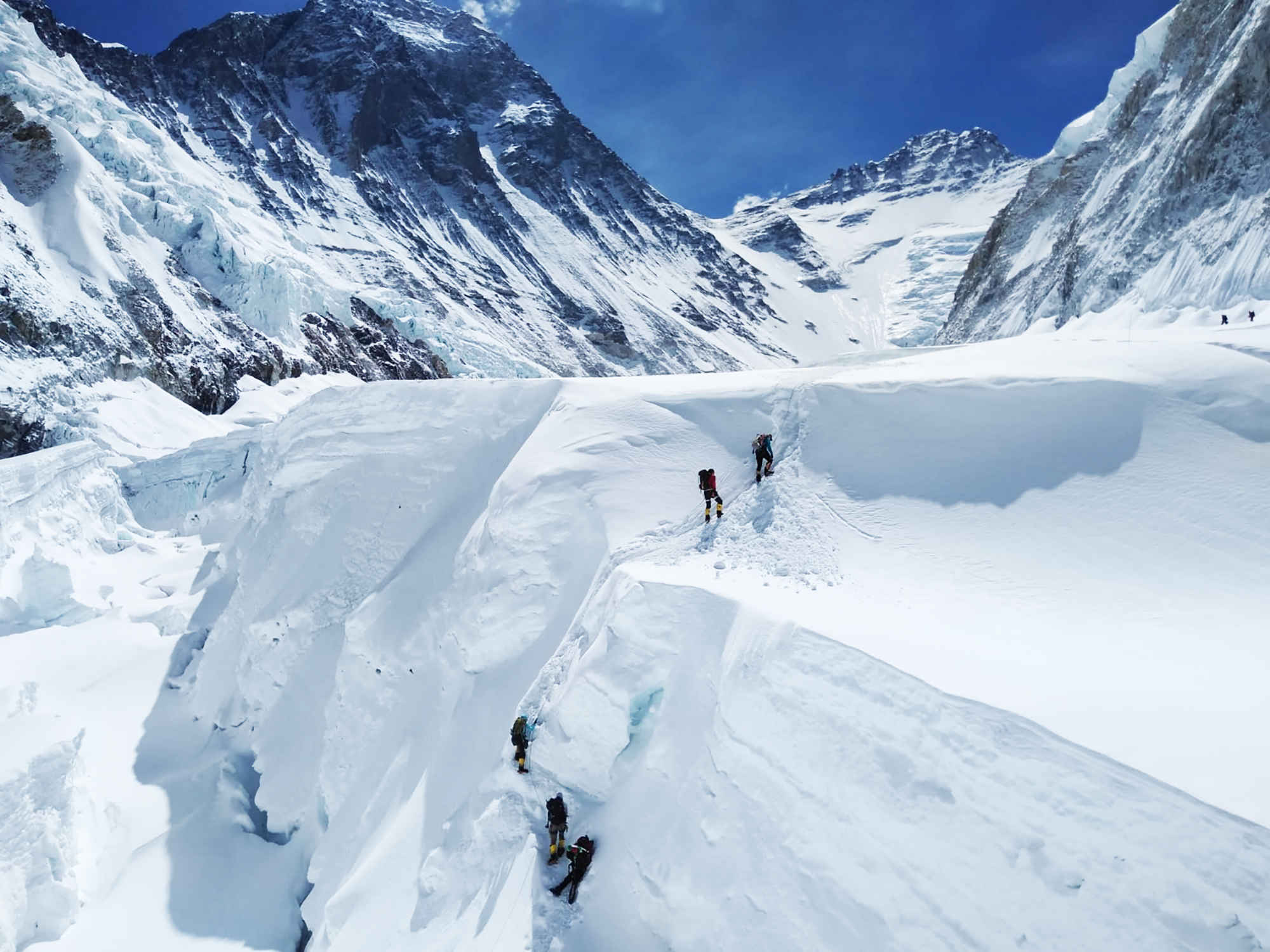 Climbers make their way up the Khumbu Icefall on their wall on our way to the Western Cwm.