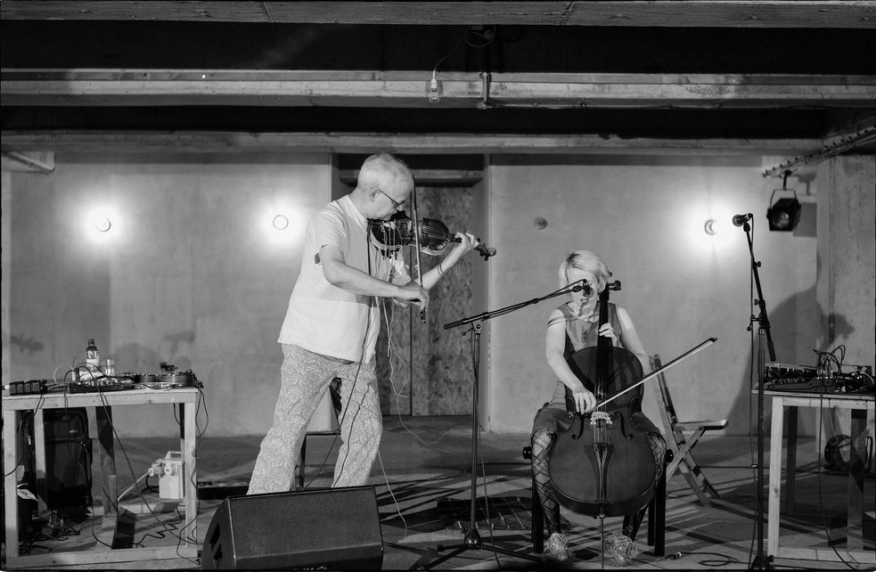 Owl Movie man plays violin and woman plays cello
