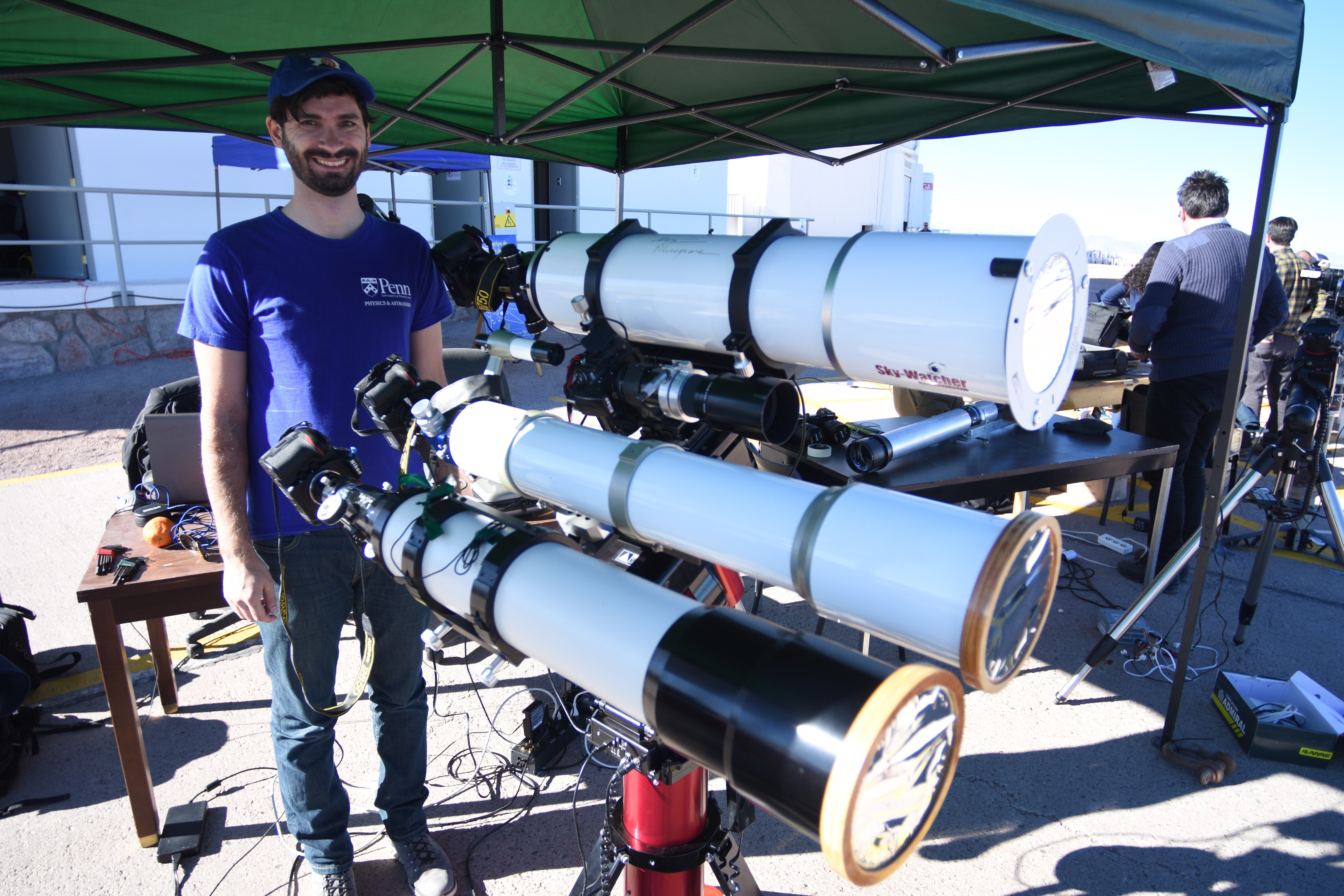 sliski posing with the three telescopes
