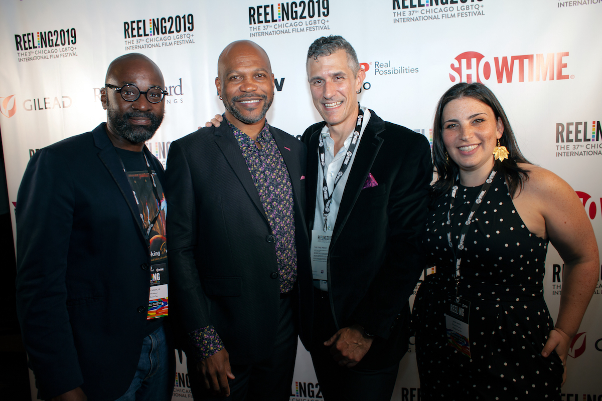 Four people standing in front of a background that reads "Reeling2019" and "Showtime."