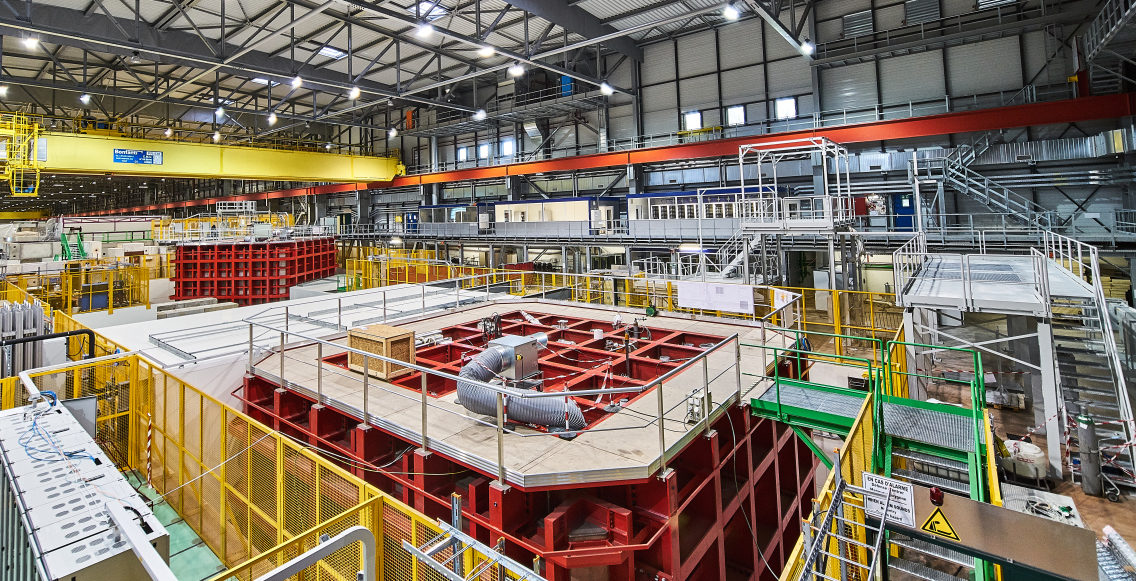 a massive room of large metal box detectors at a particle accelerator facility