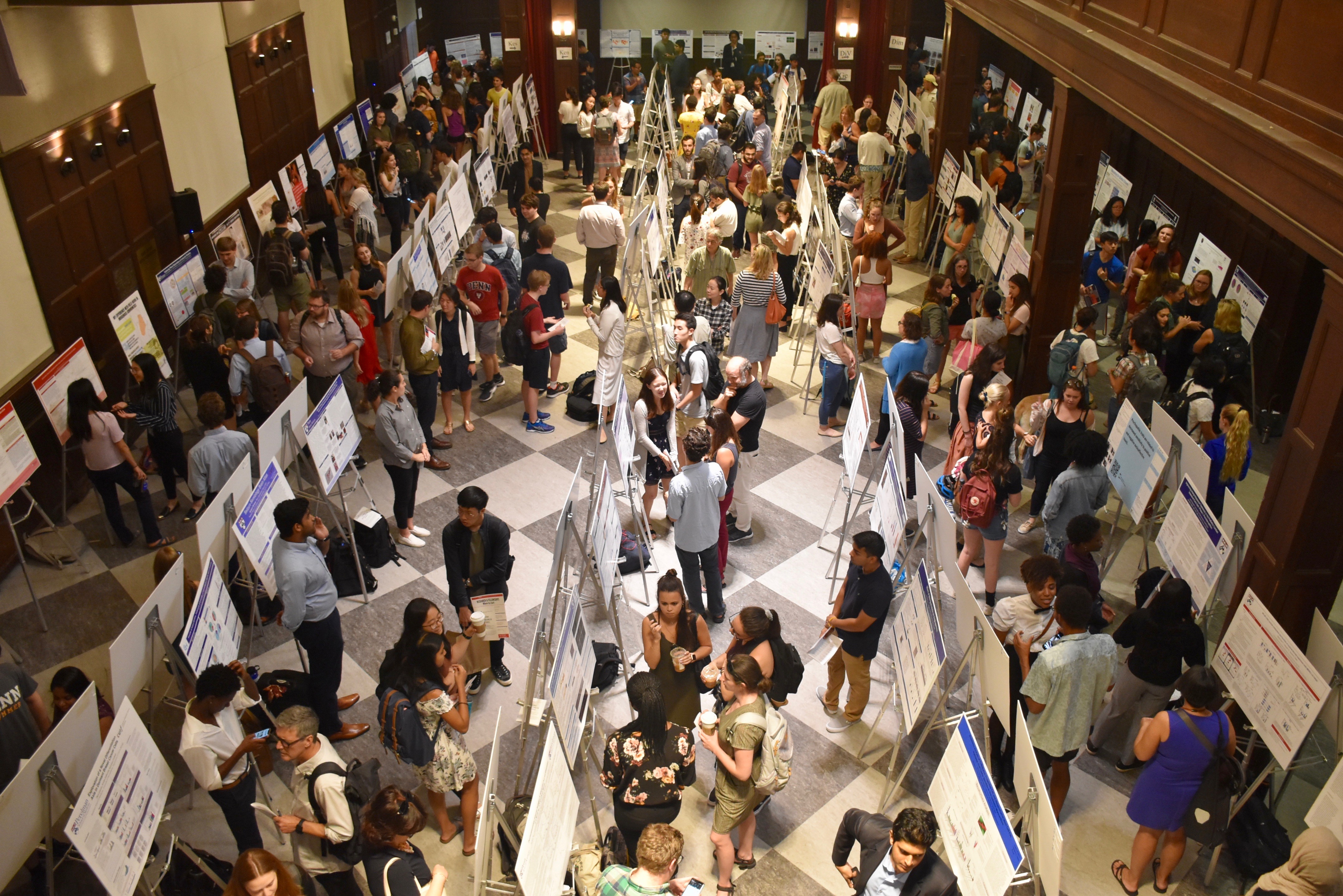 Aerial view of hallway filled with CURF poster displays and students