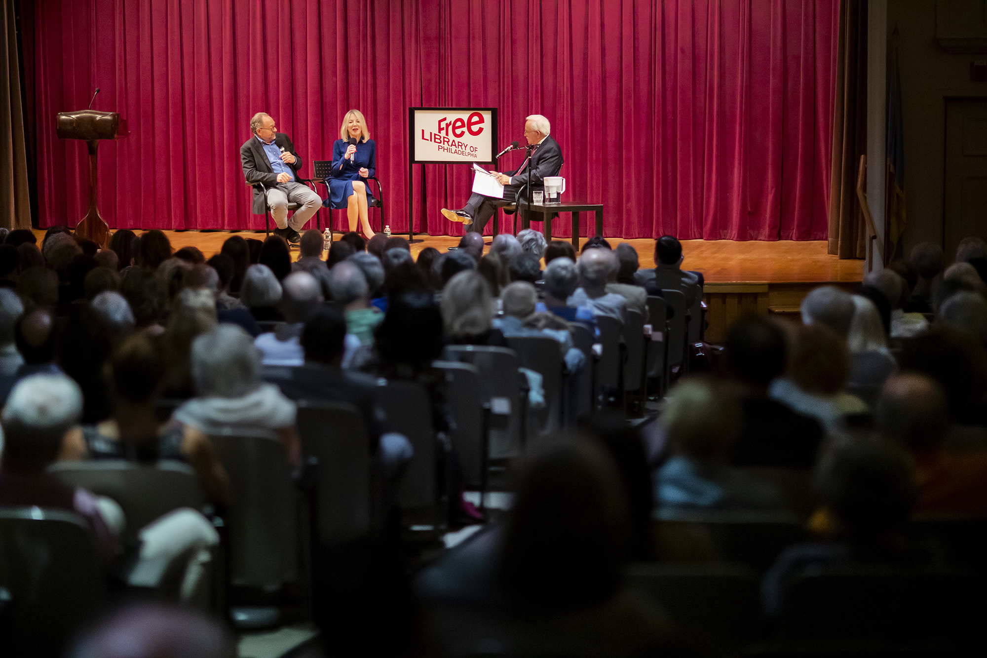 Moreno, Gutmann, and Gardner on stage at Free Library