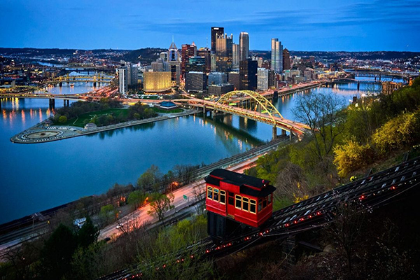 Evening view of Pittsburgh skyline along one of its rivers