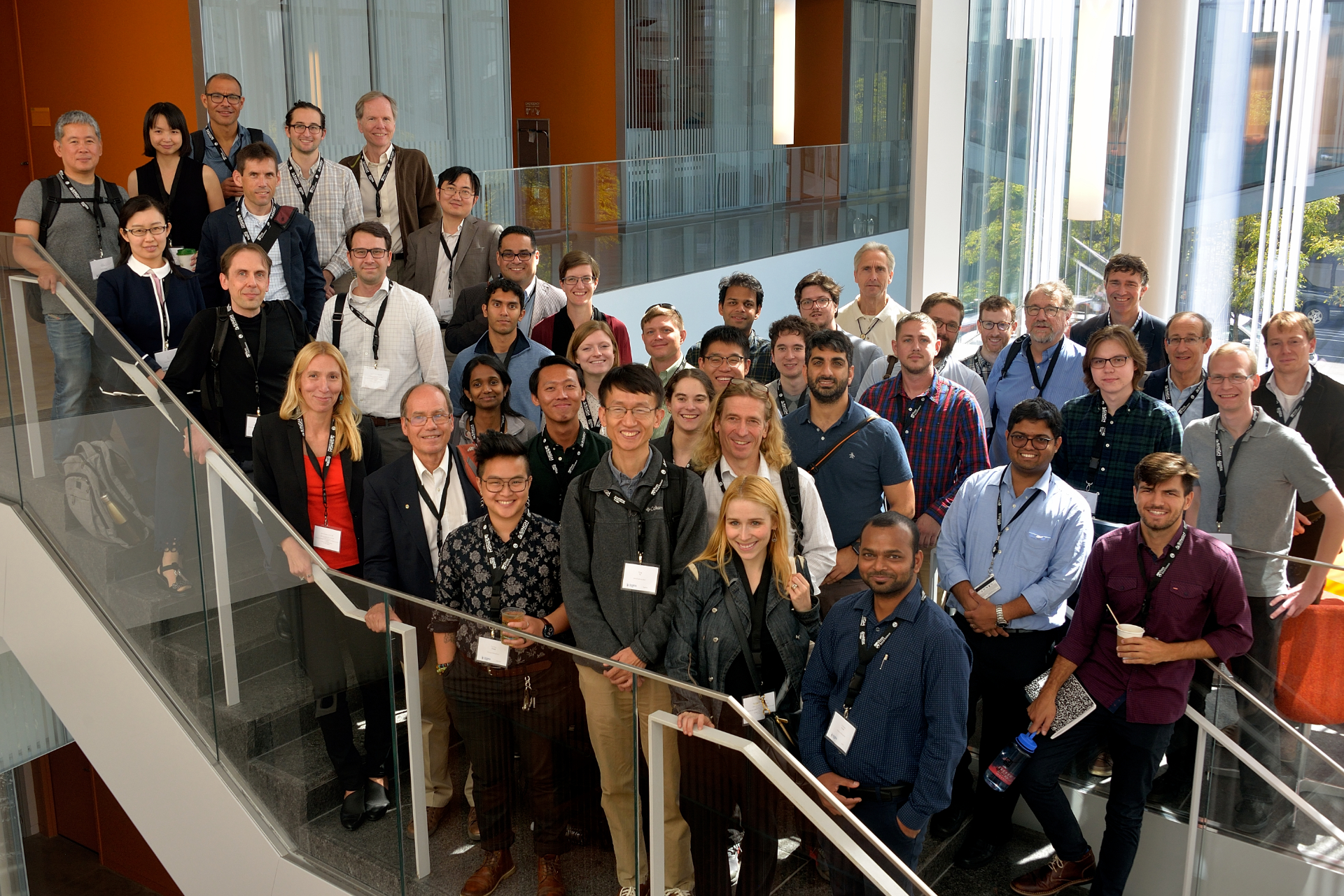 a group of 40 people posing on a staircase