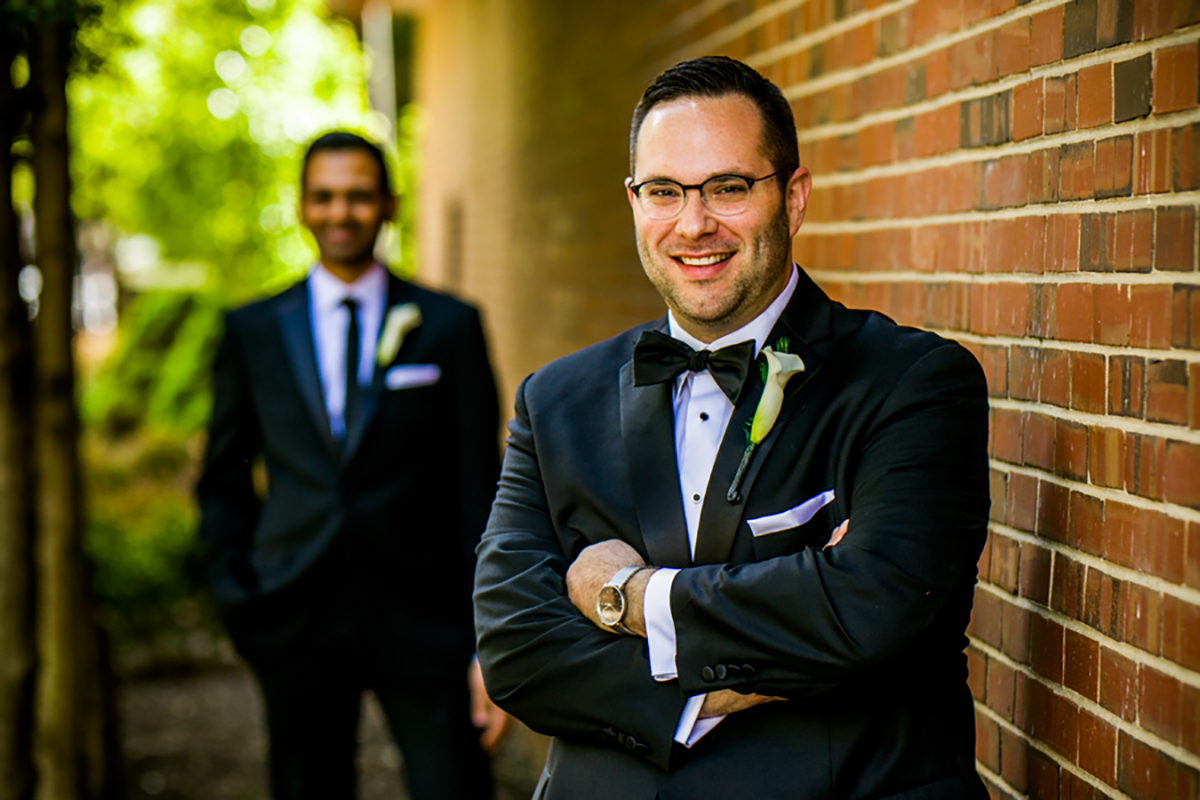 Jason Freedman (foreground) on his wedding day to his husband, Neil, in 2016