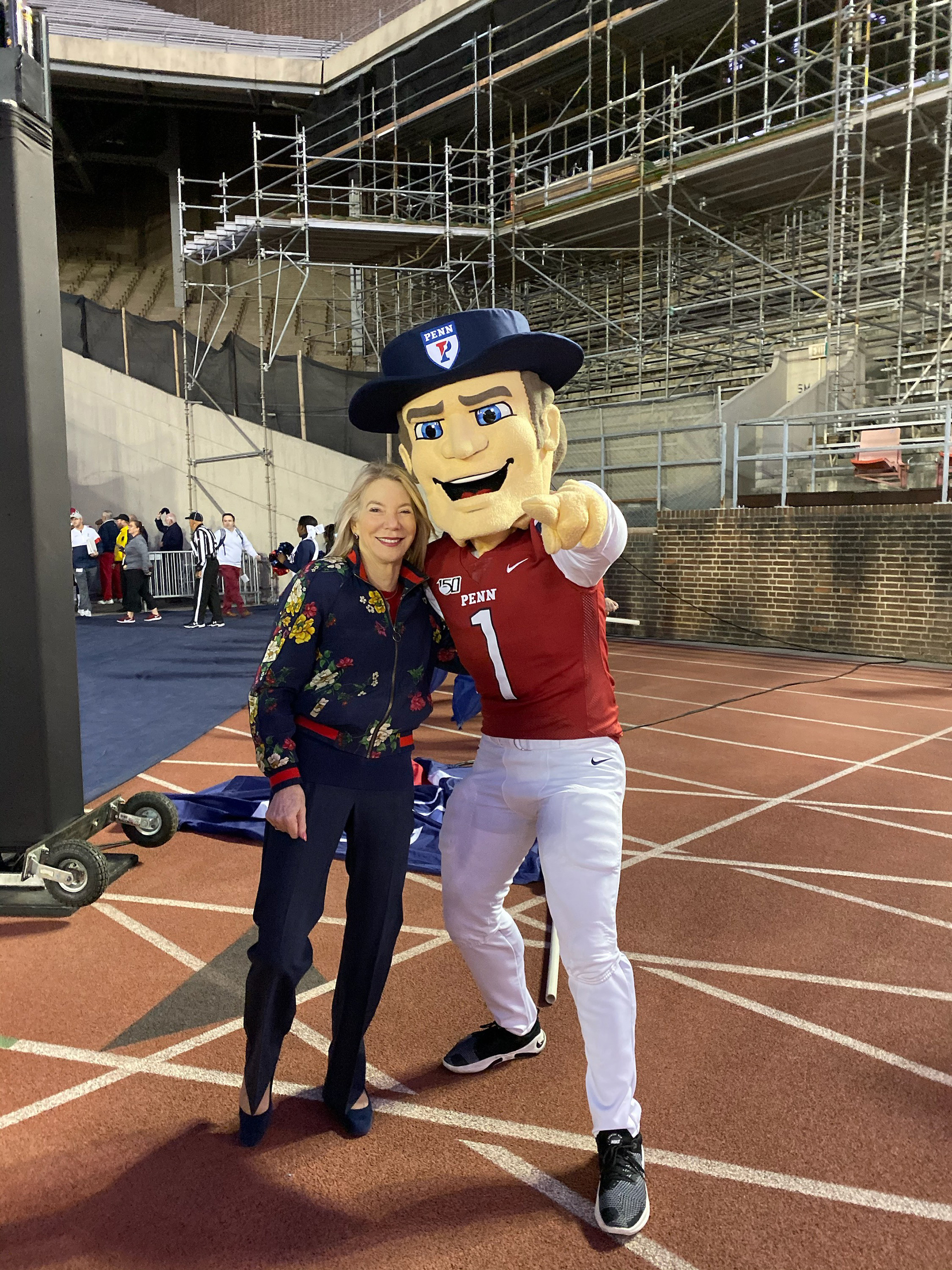 President Amy Gutmann poses with the Quaker on Friday at Franklin Field.