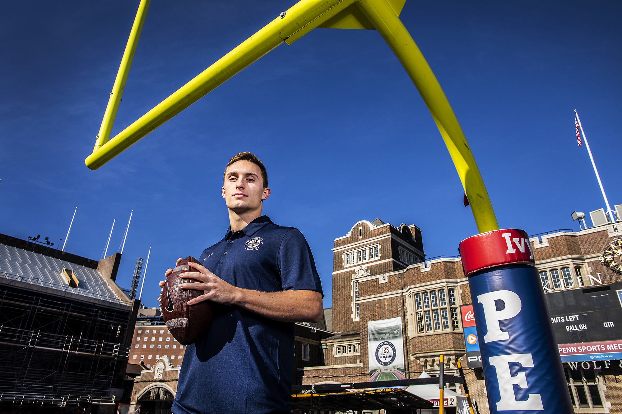 Eddie Jenkins of the sprint football team poses with a football in the end zone at Franklin Field.