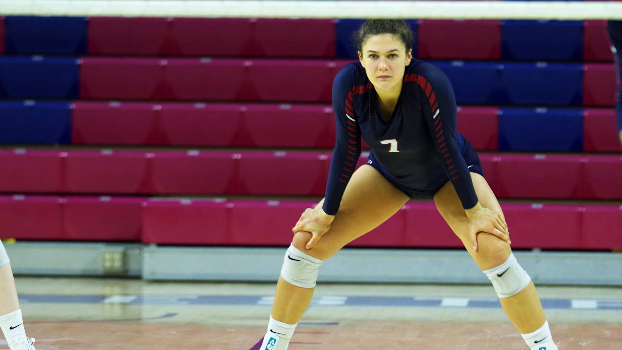 Parker Jones stands with her hands on her knees at the Palestra.