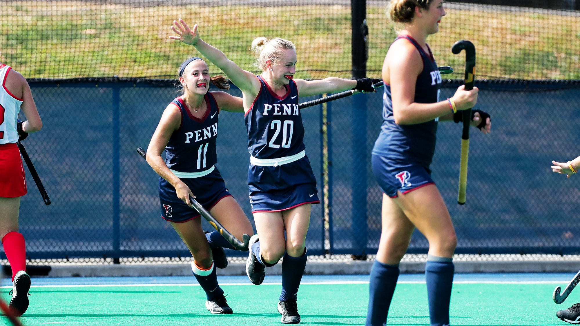 Sophomore forward Maddy Fagan, No. 20, celebrates with her teammates.