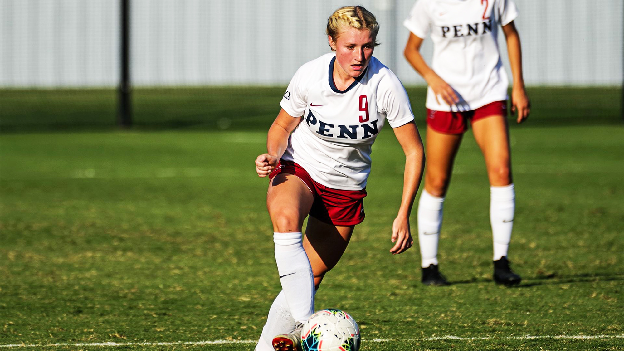 Sizzy Lawton dribbles the ball down the field against Darthmouth.