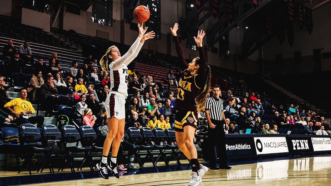Phoebe Sterba shoots a three over an opponent against Iona at the Palestra.