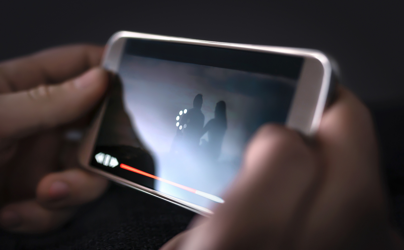 closeup of a smartphone buffering while streaming video