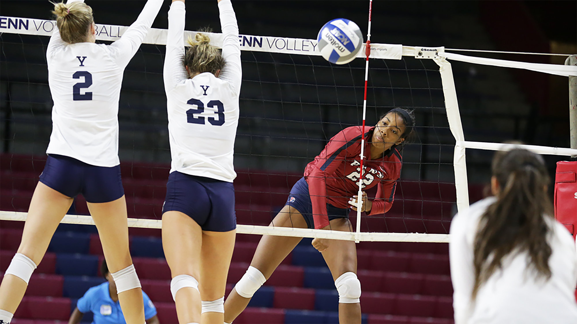 Freshman Autumn Leak serves the ball against Yale at the Palestra.