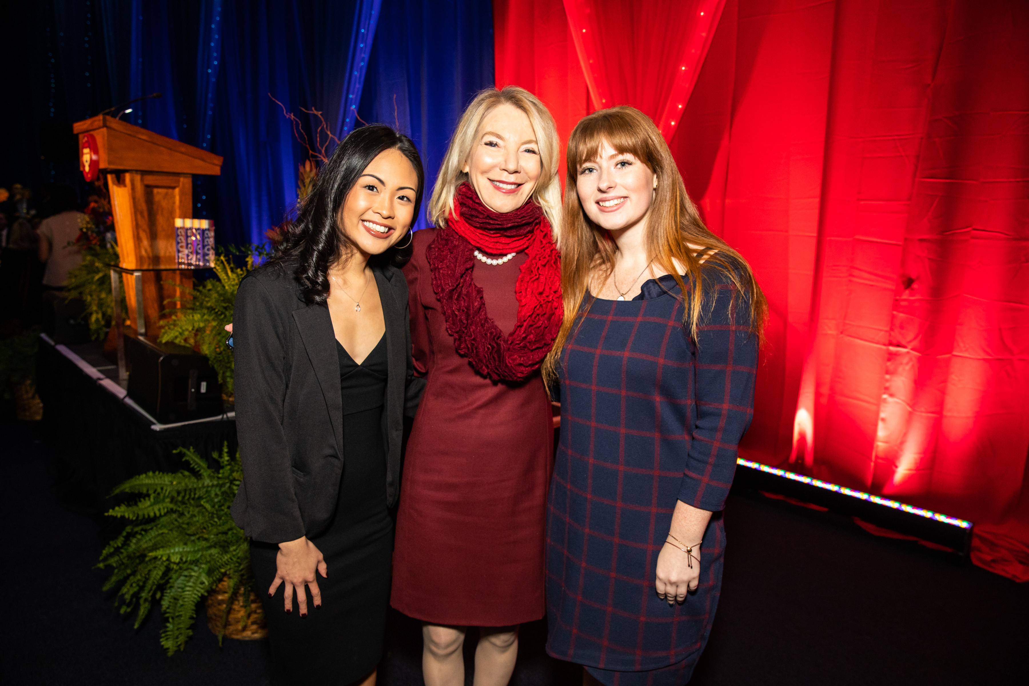 scholarship celebration, angelica, gutman, boote pose for a photo