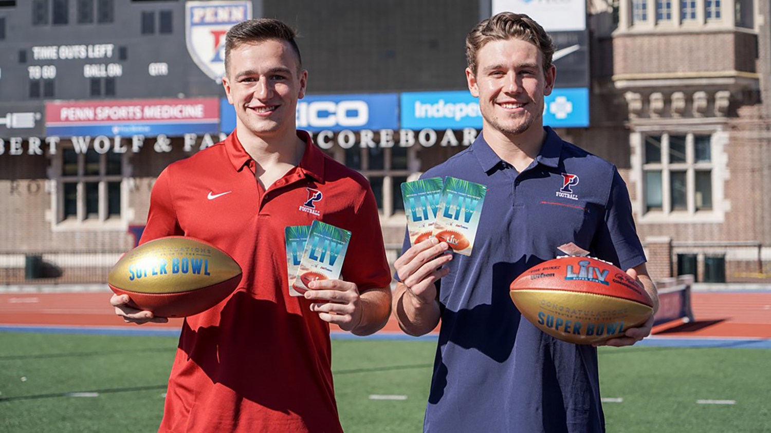Anthony Lotti and Sam Philippi hold tickets to the Super Bowl in one hand and footballs in the other on a football field.