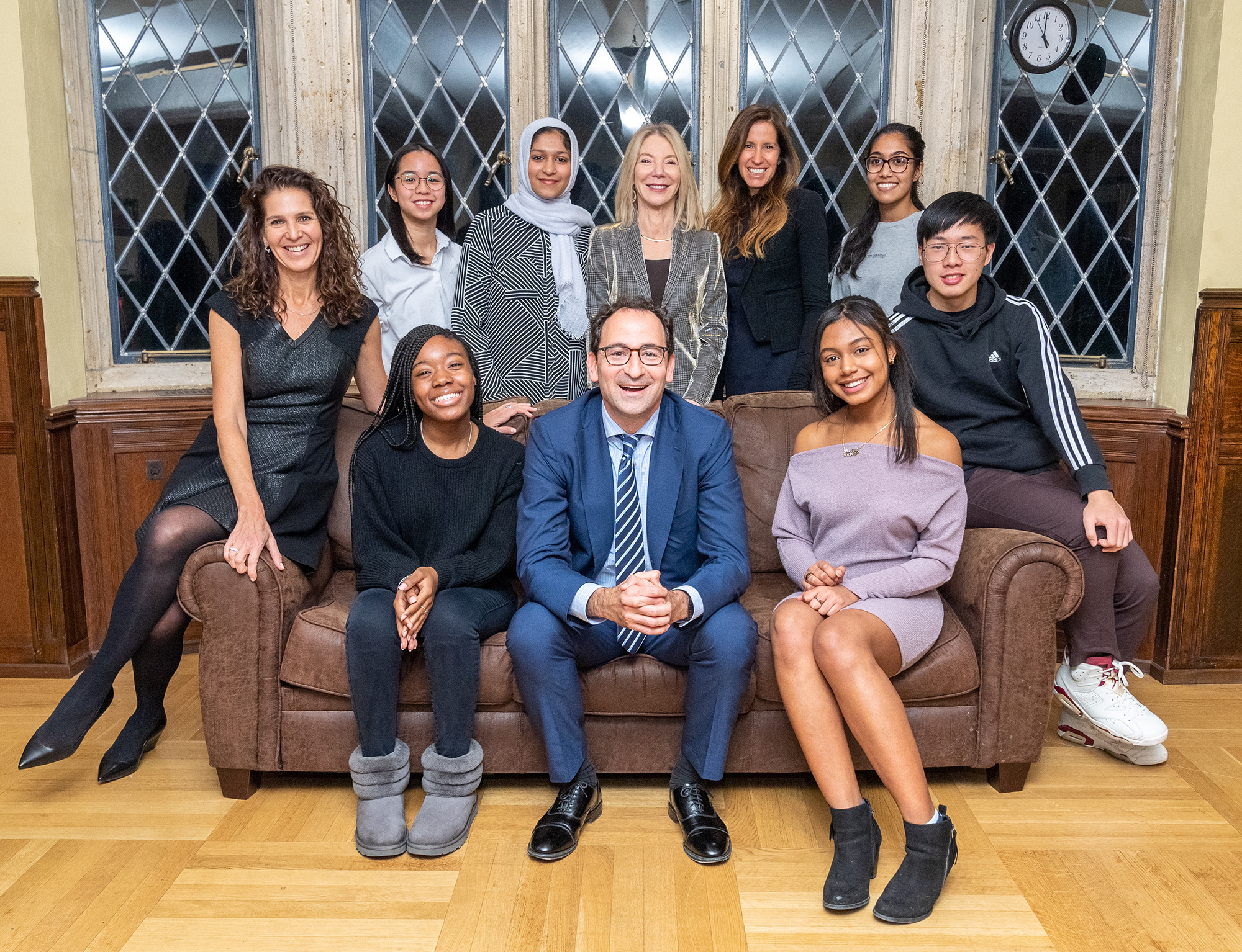 During a study break, President Amy Gutmann and Jon and Mindy Gray congratulate the first cohort of student scholars in the Penn First Plus program that the Grays’ gift is supporting. 