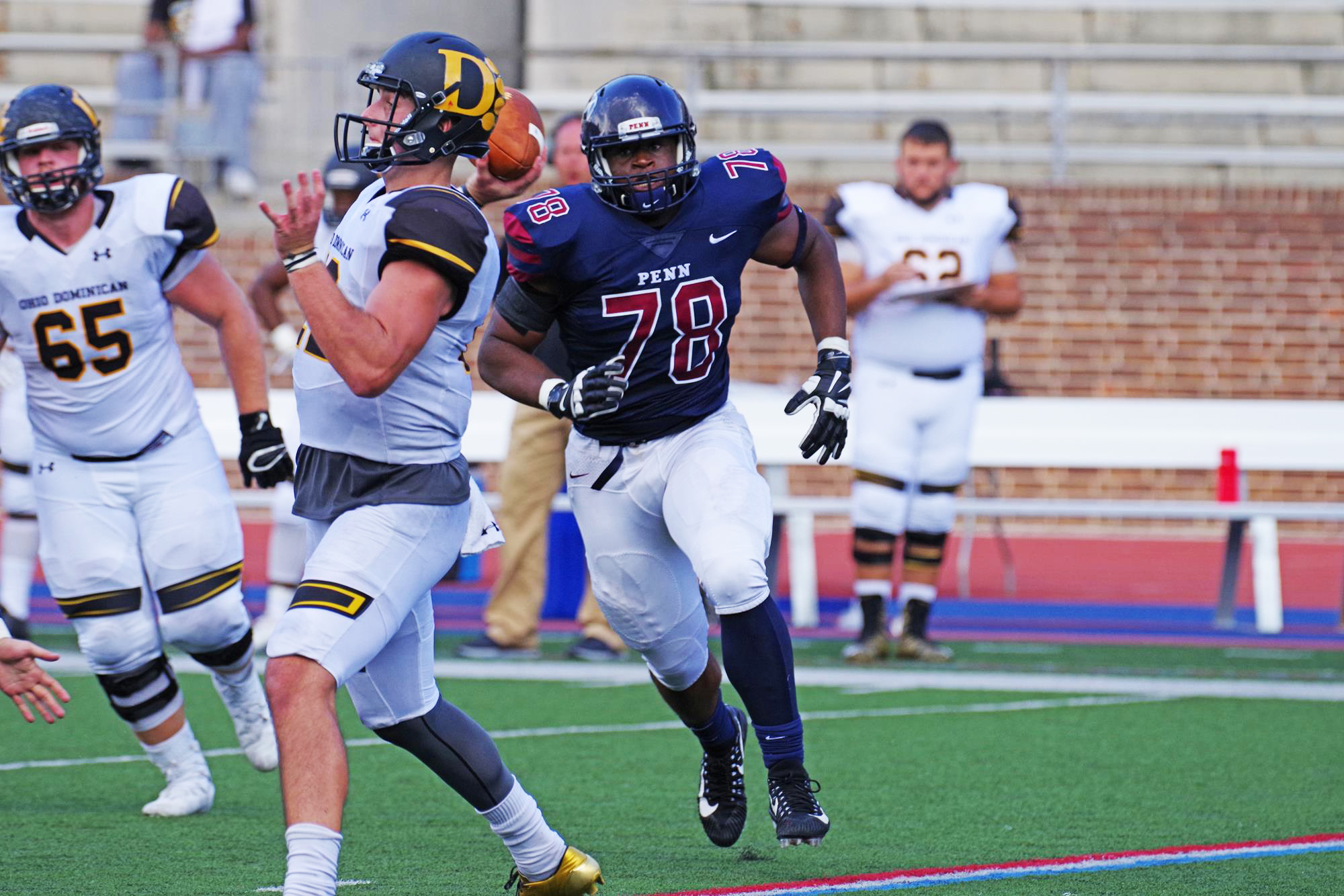 Prince Emili rushes the quarterback during a game at Franklin Field.