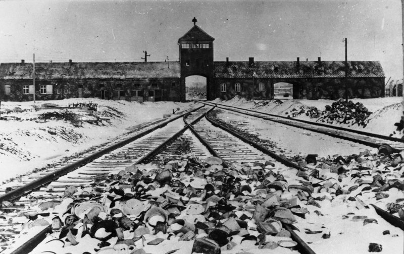  Auschwitz concentration camp entrance after the liberation, equipment left in the foreground by the guards