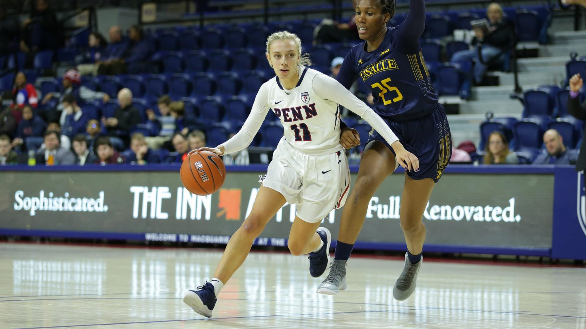 Against La Salle at the Palestra, Kendall Grasela dribbles to the basket.