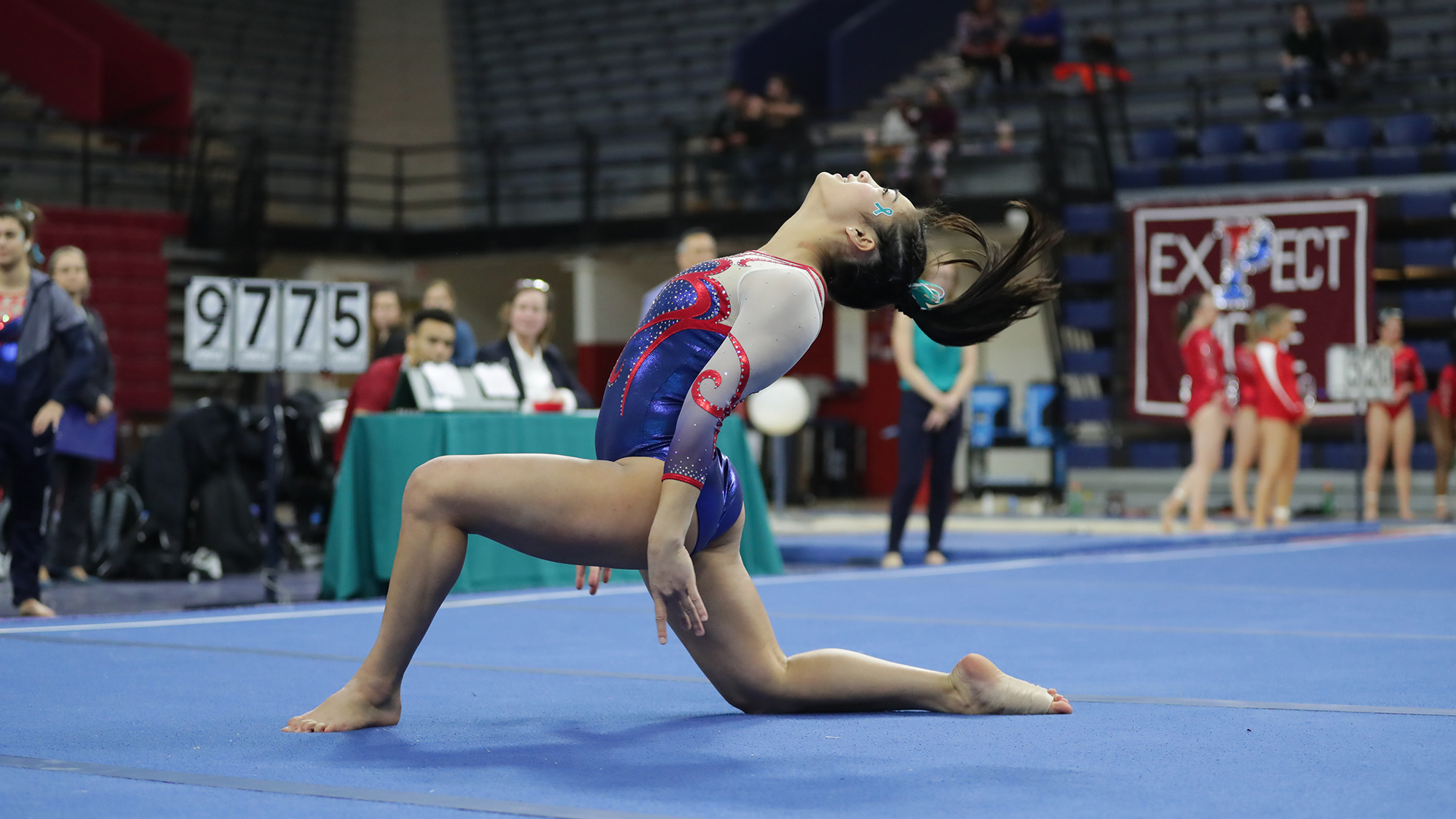 Sydney Kraez poses on the mat during her floor routine.